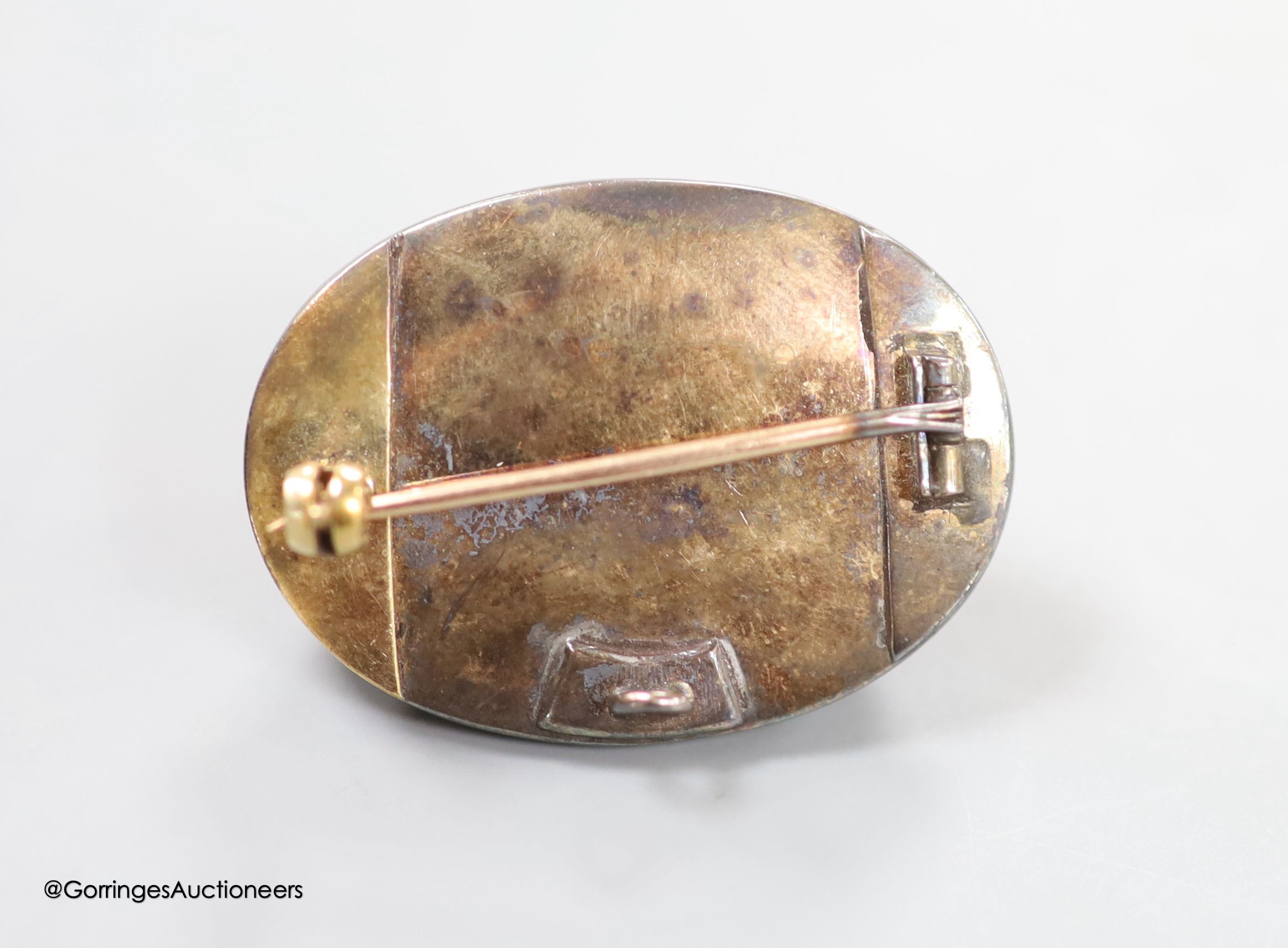 A 19th century yellow and white metal, oval cabochon garnet, rose and old cut diamond set brooch(adapted and stone cracked), with central star motif, 34mm, gross weight 15.9 grams.